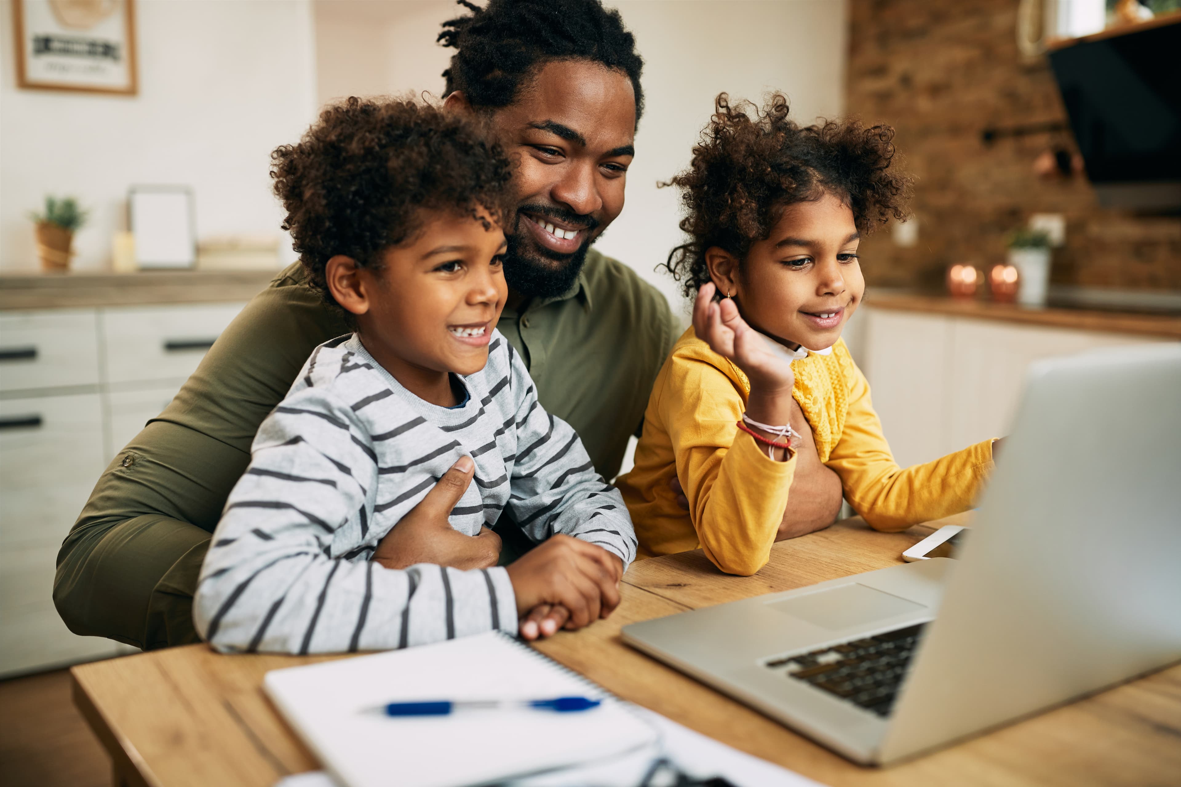 Father helping children with homework
